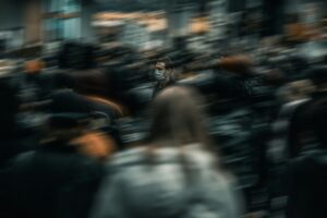 Blurred image of a crowd of people symbolizing the collective shadow